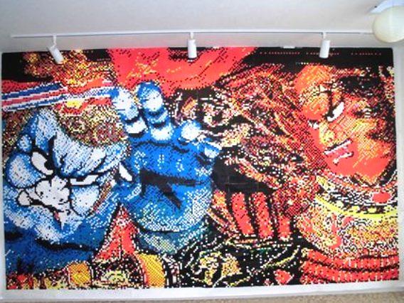 スタッフが企画したモザイク画です。1.5mm四方に切った折り紙を約4,400枚貼り合わせてます。